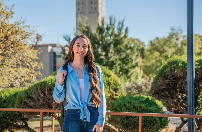 Marissa Steben smiles at camera standing outside